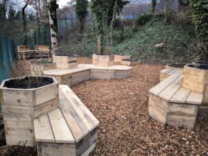 Image shows new area with reclaimed wooden seating provided by Touch Wood