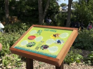 Image shows a close up of the sign for the Rewilding Project